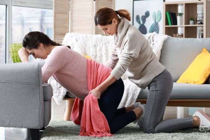 Chiropractor Helping Mother