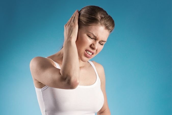 adult female having symptoms of ear infections