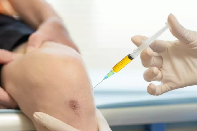 cortisone being injected into knee but not by a chiropractor but a doctor